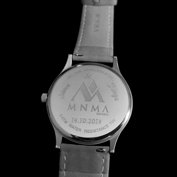 Watch with engraving of MNMA on back